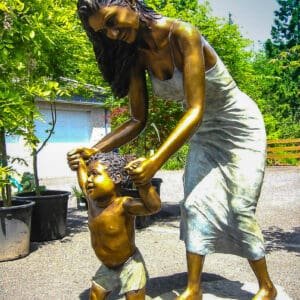 Brone Statue Mother Teaching Her Kid The First Step