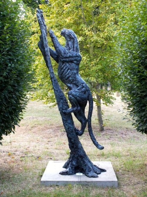 Life Size Leopard Climbing Tree Sculpture In Bronze